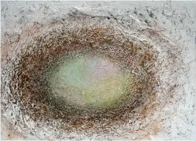 A detailed mixed media artwork incorporating plaster and fabric.